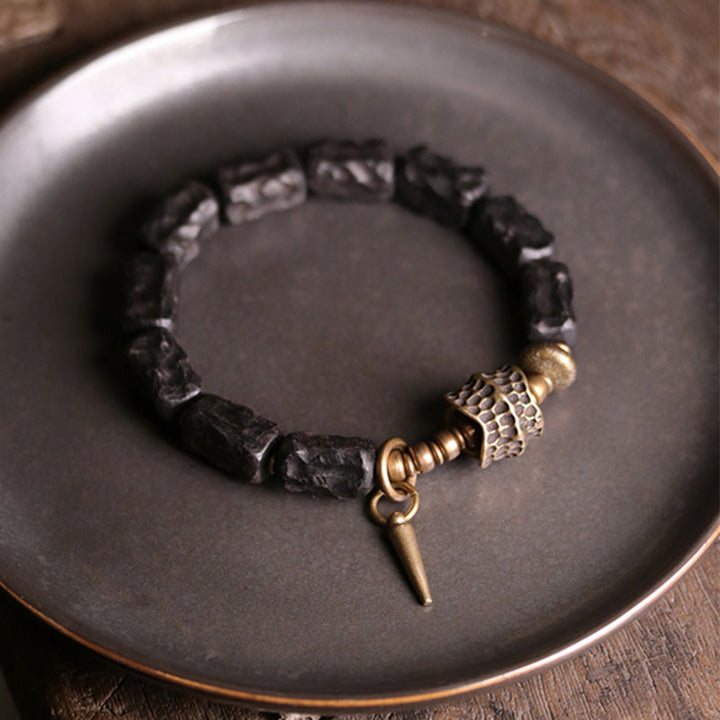 Armband Kupfer Ebenholz Paar Schutz Balance schwarze Natursteine Metallverzierungen.