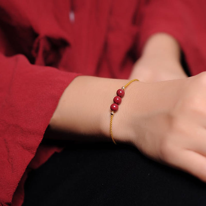 Armband Zinnober – Segen & Segen rote Perlen Goldkette elegant