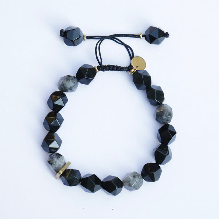 Schwarzes Obsidian Armband mit Natursteinen und Goldelementen elegant.