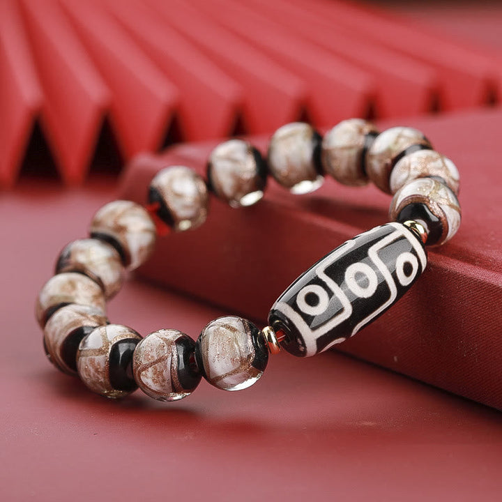 Armband – Wohlstand Balance mit Perlen und Tibetan-Auge Perle elegant.