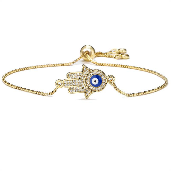Goldenes Armband Böses Auge – Schutz & Mut mit blauem Stein Hamsa Hand