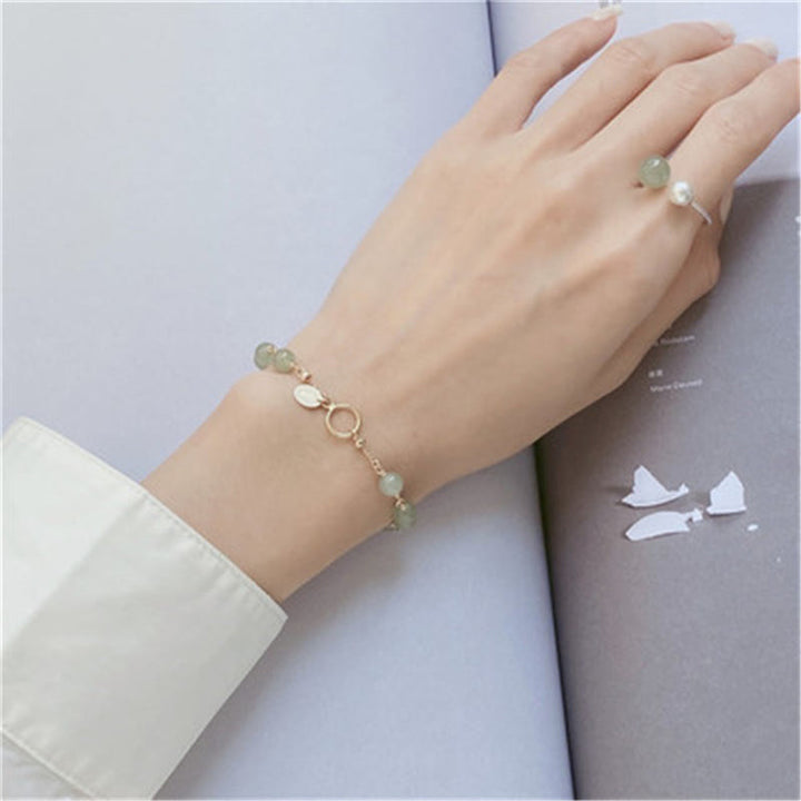 Armband Jade Gold Wohlstand am Handgelenk mit Ring eleganter Look