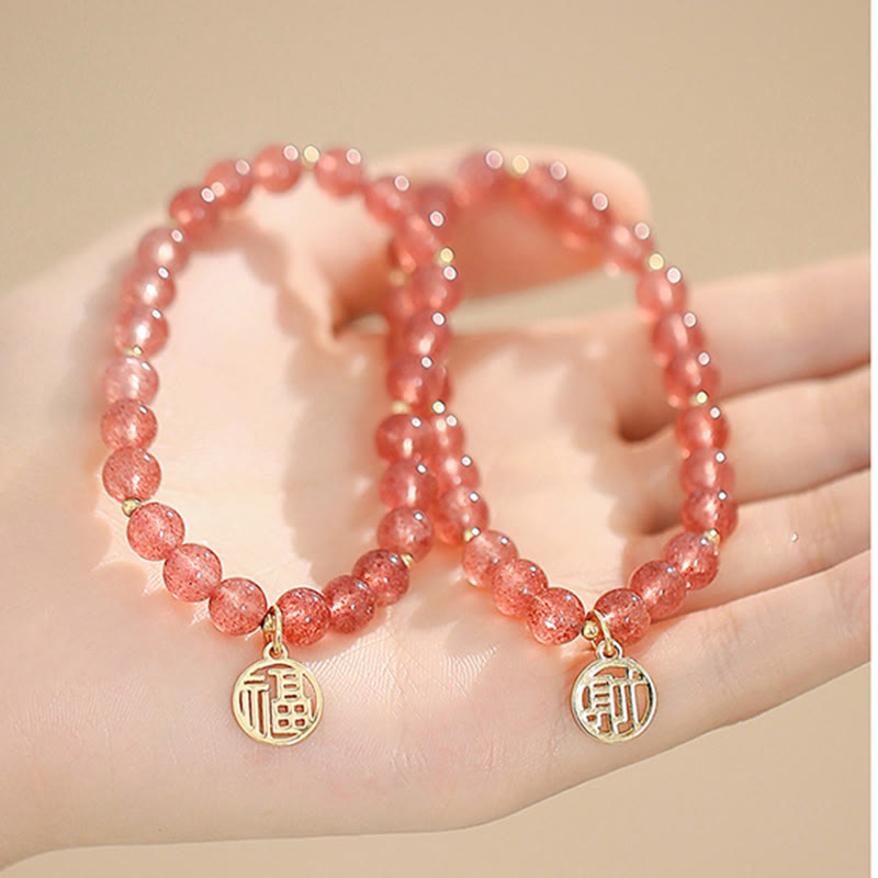 Armband Erdbeerquarz Fu-Zeichen elastisch Naturstein Perlen Goldanhänger