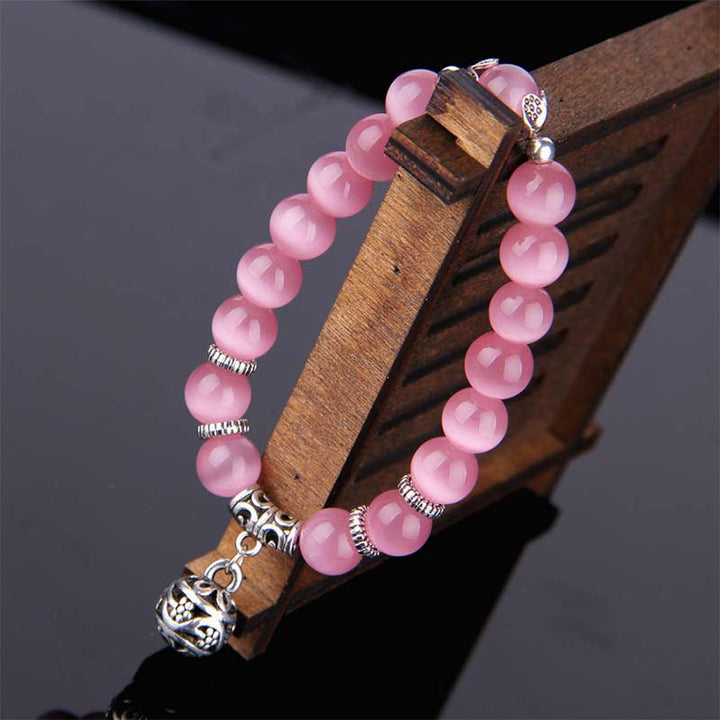 Rosa Quarz Perlen Armband mit silbernen Verzierungen elastisch