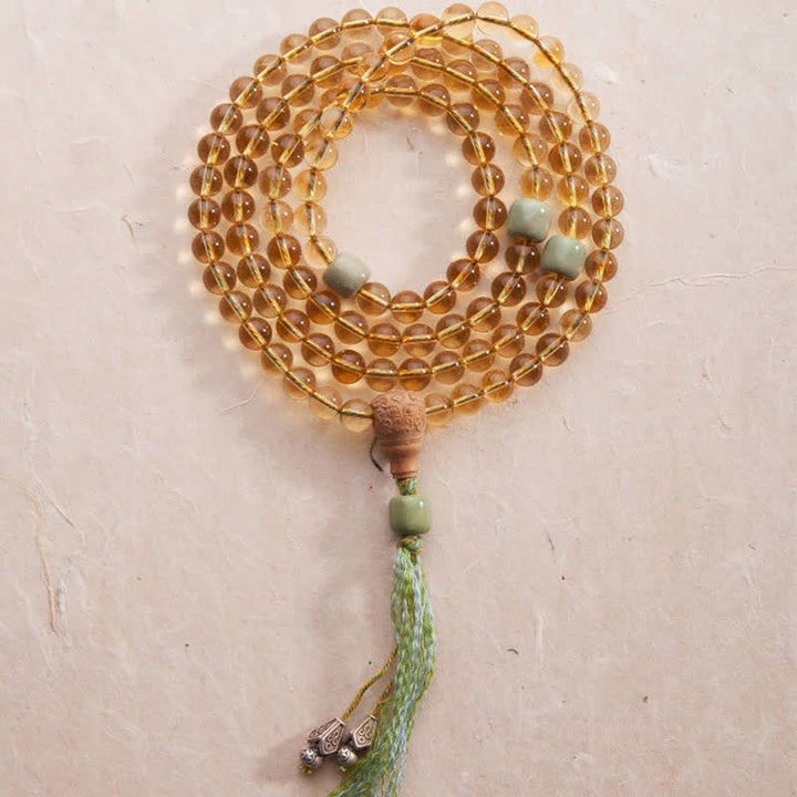 Mala Armband mit Sandelholz, Jade Perlen und grüner Quaste.