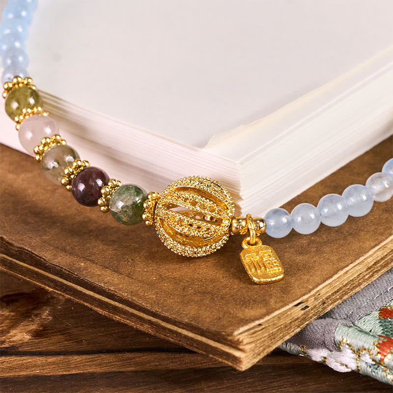 Schlüsselanhänger Fu Chalcedon Emotionale Balance bunte Edelsteine goldener Anhänger spirituell