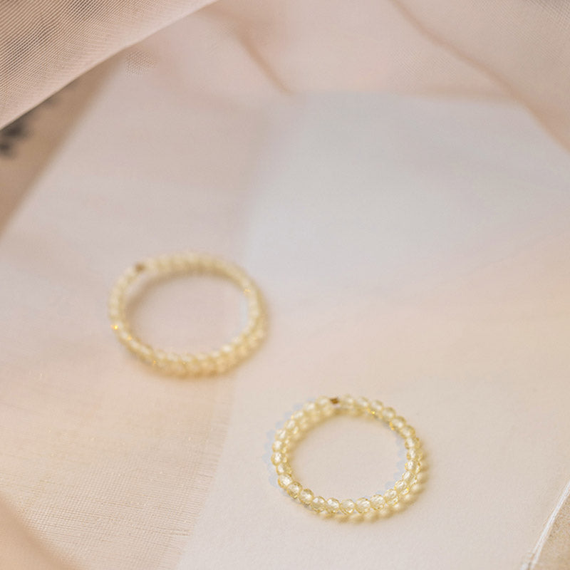 Zwei Zitrin Ringe mit Perlen-Design für Wohlstand und Glück