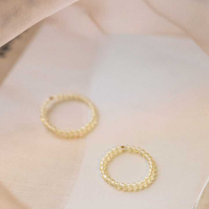 Zwei Zitrin Ringe mit Perlen-Design für Wohlstand und Glück