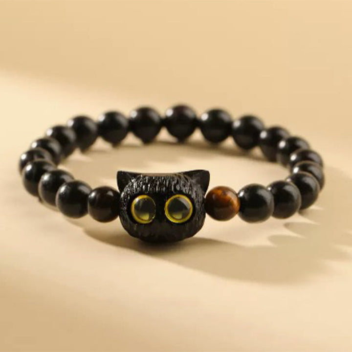 Armband Ebenholz Katze schwarze Perlen goldene Augen elastisch