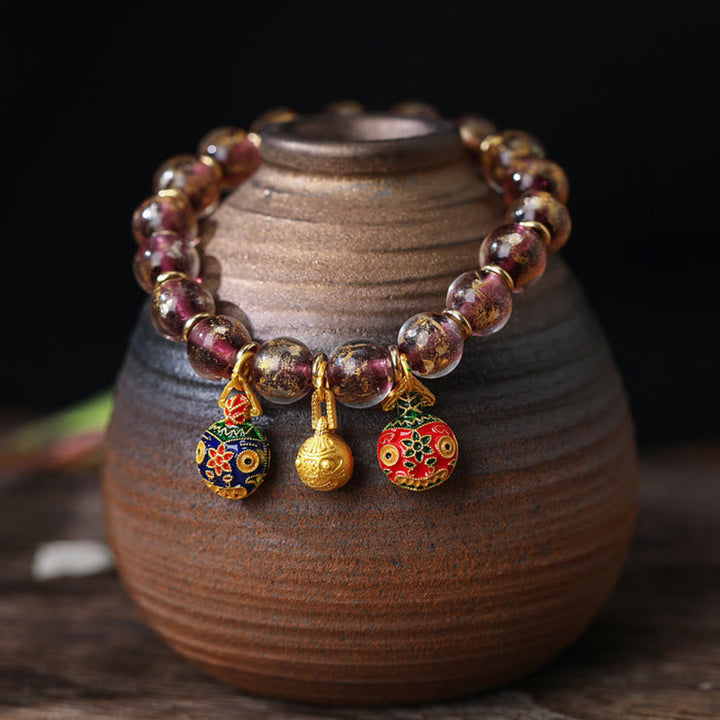 Bernstein Armband Silber – Segen mit goldfarbenen Charms elastisch.