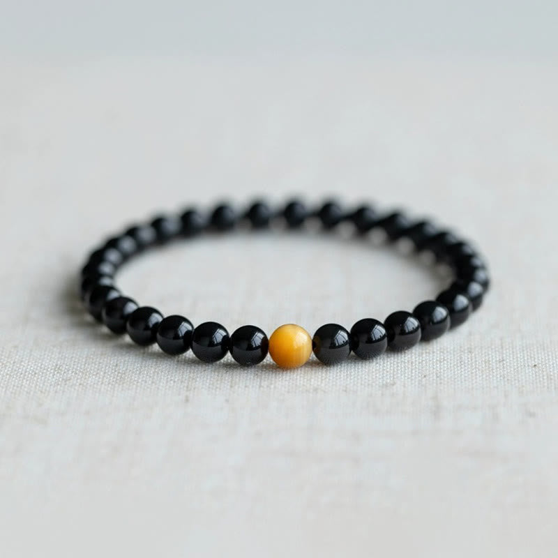 Schwarzes Obsidian Armband mit gelbem Tigerauge Stein elegant