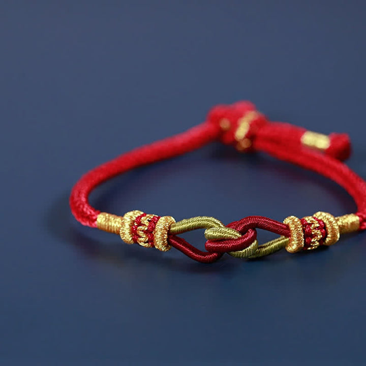 Rotes geflochtenes Armband mit goldfarbenen Verzierungen Knotting Faith Stärke