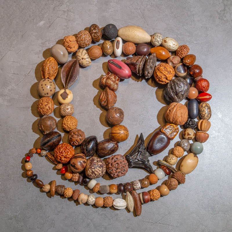 Mala Bodhi Glück Wohlstand Armband aus Natursteinen und Holzperlen.