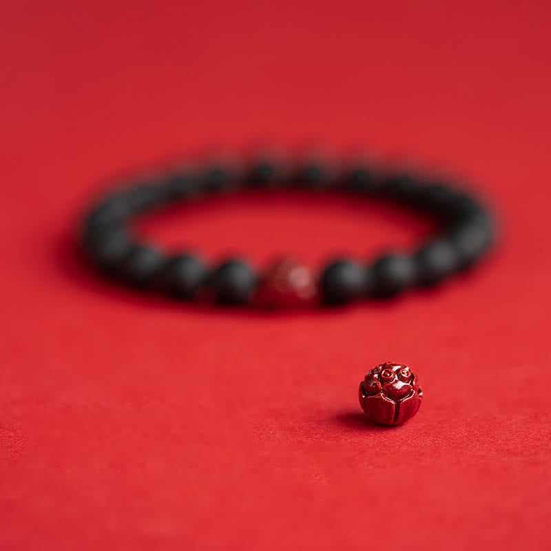 Armband Zinnober Lotus – Heilung schwarze Perlen rotes Licht
