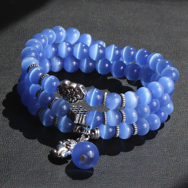 Blaues Katzenauge Armband PiXiu Dreifach mit Silberverzierungen elegant.