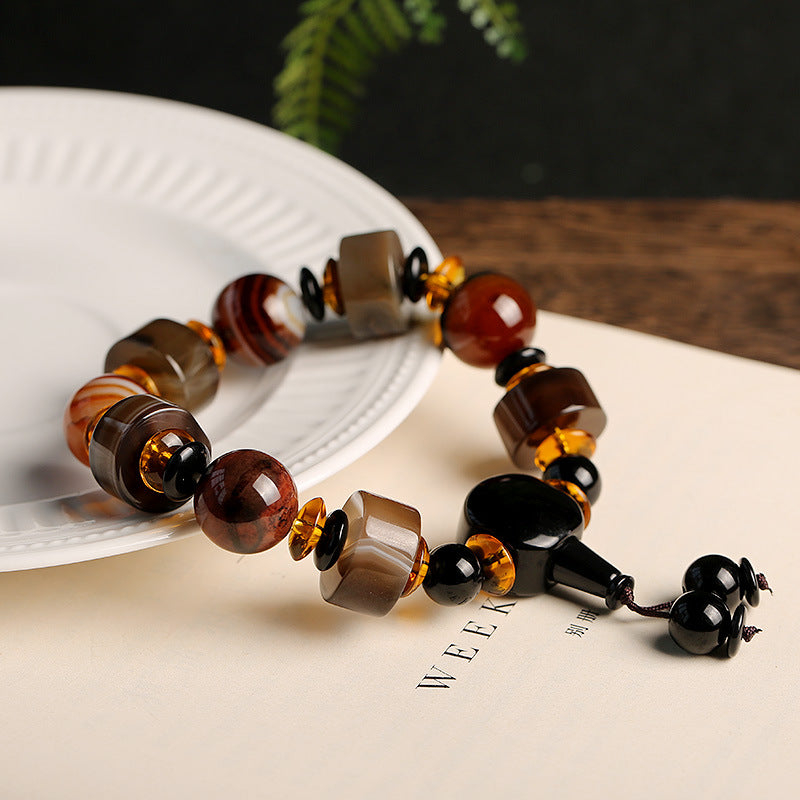 Armband Onyx – Glück Balance mit braunen Natursteinen elegant arrangiert