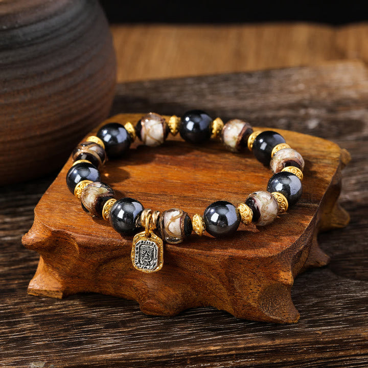 Armband Zakiram mit schwarzem Obsidian und goldenen Perlen Glück Wohlstand