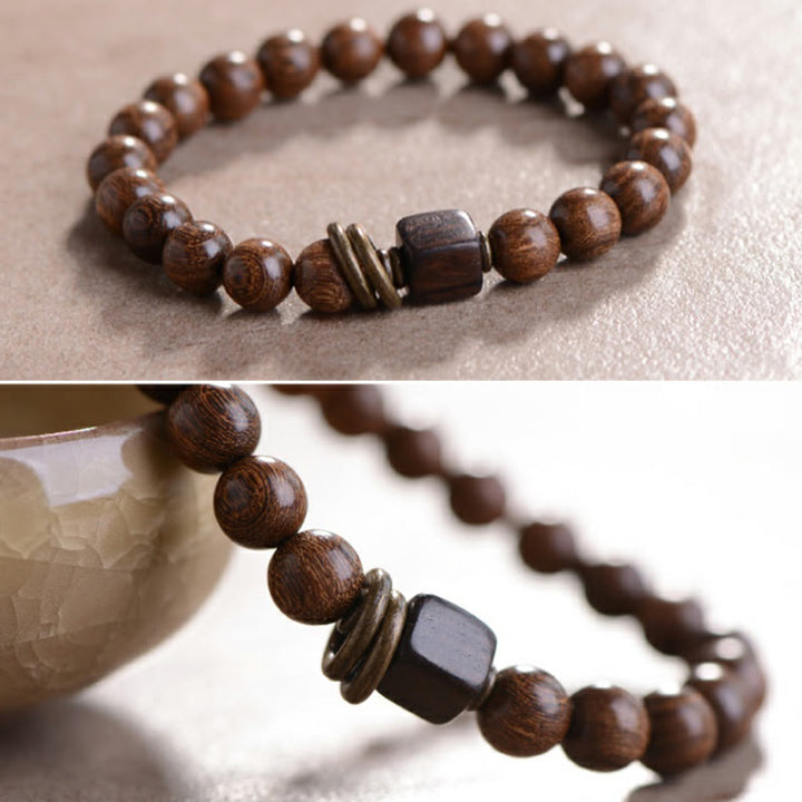 Armband Phoebe Zhennan Holz Spirituality braun Perlen Metallakzent elastisch