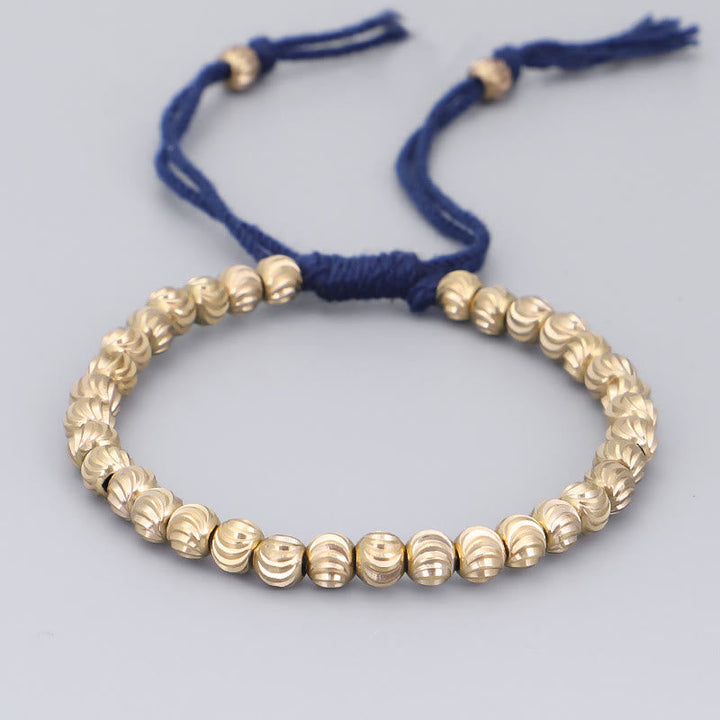 Armband Kupfer – Glück Balance mit goldenen Perlen blauem Seidenfaden