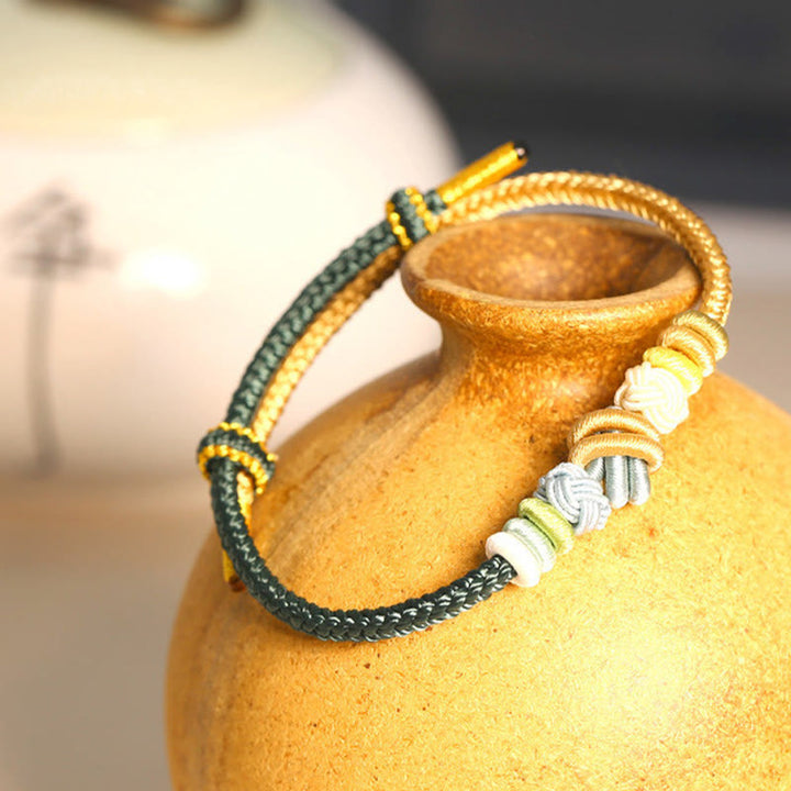 Armband – Glück & Frieden mit grünen und goldenen Perlen Schnur