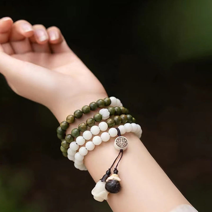 Armband Sandelholz Bodhi – Energie grüne weiße Perlen Handgelenk