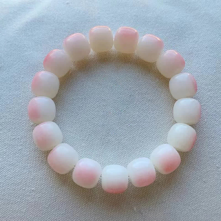 Rosenquarz Perlen Armband mit rosa-weißen Natursteinen elastisch getragen