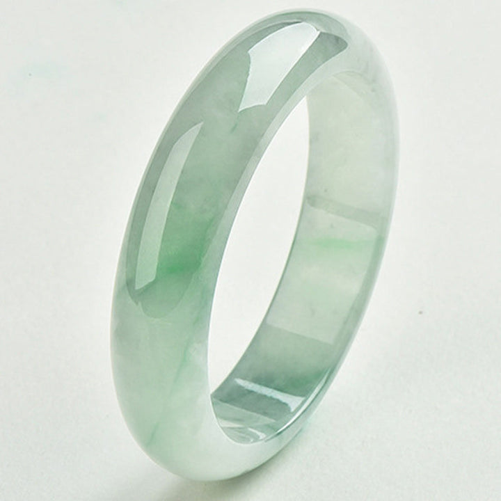 Armband Jade hellgrün poliert Naturstein glatt elegantes Design Wohlstand