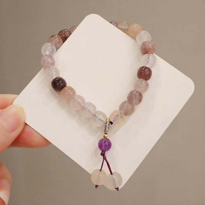 Jade Armband mit rosa Steinen und lila Anhänger elegant.