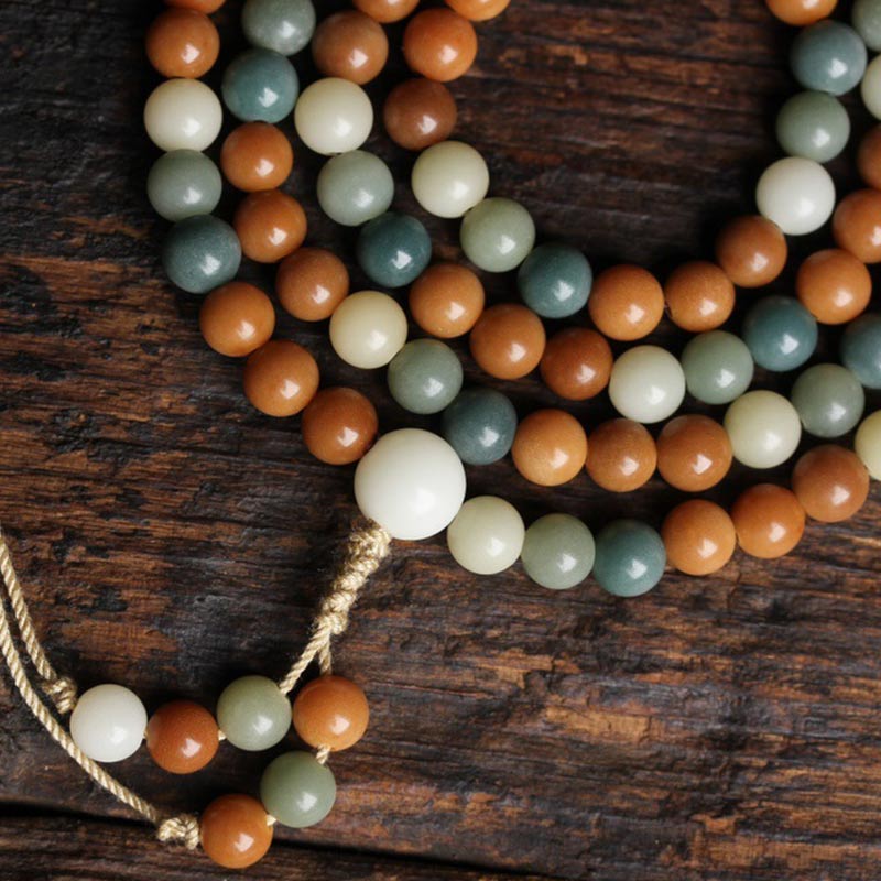 Mala Bodhi Harmonie Perlenarmband Holz Naturstein Flatlayaufnahme Holzuntergrund