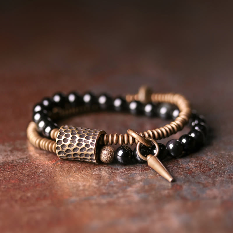 Armband Obsidian Kupfer mit schwarzen Perlen und Metallverzierungen elegant.
