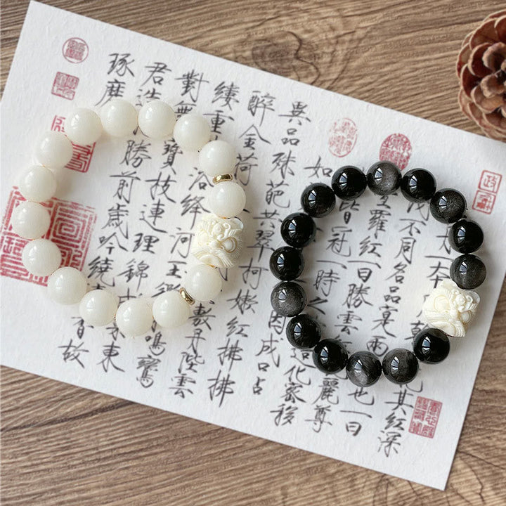 Armband mit weißem Bodhi und schwarzem Obsidian Schutz elegant.
