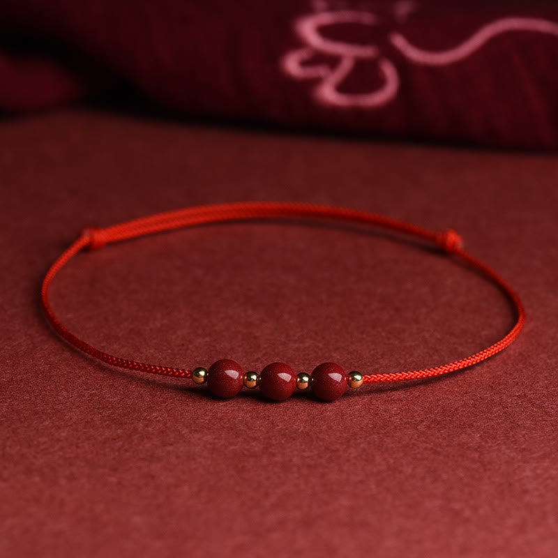Rotes Armband Zinnober – Glück & Segen mit Perlen auf Stoff