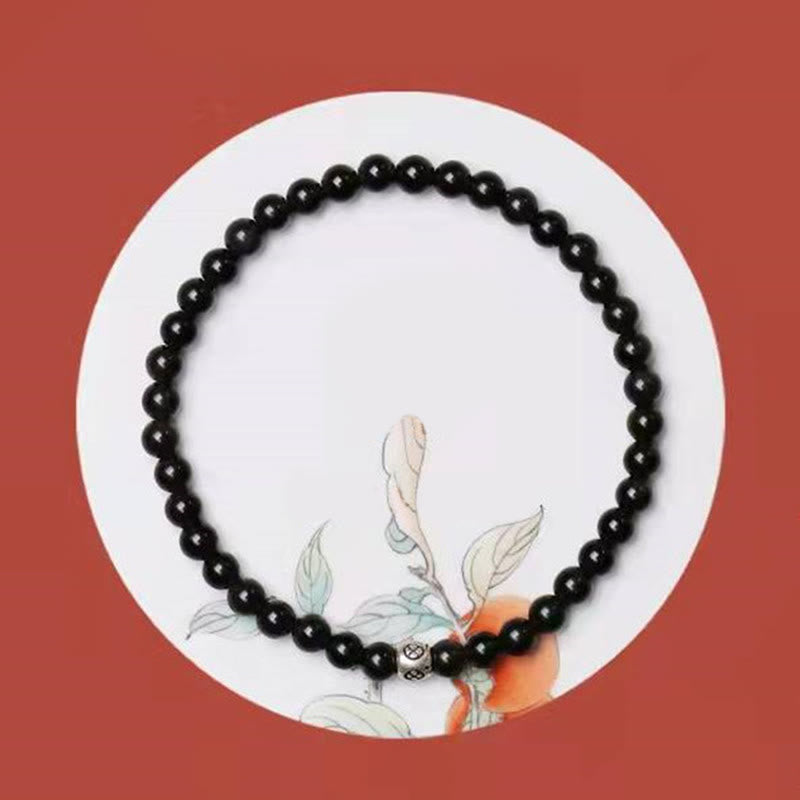 Armband Schwarzer Obsidian Katze – Stärke mit Blattmotiv Flatlays