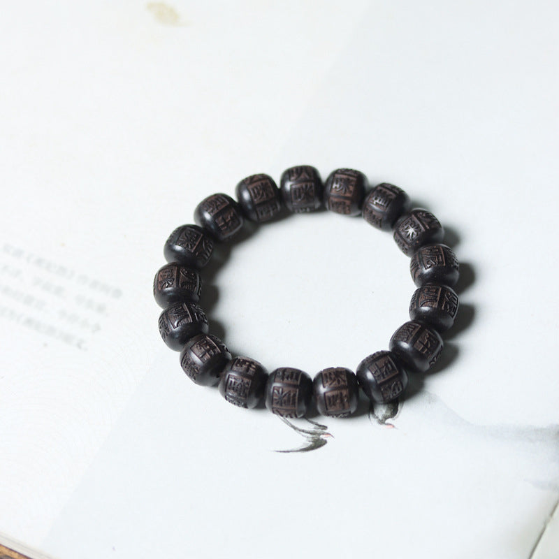 Ebenholz Armband mit Om Mani Padme Hum Gravur, elastisch getragen