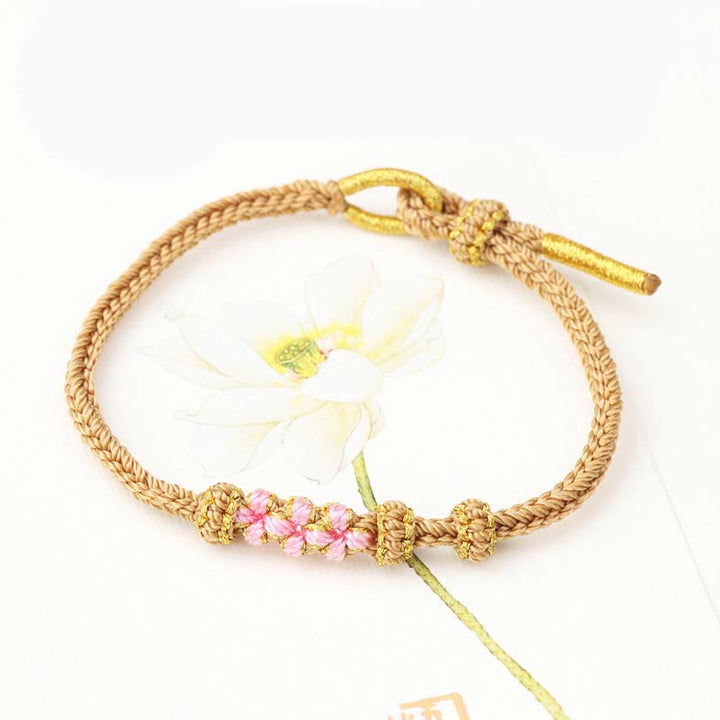 Armband Pfirsichblüte – Glück mit rosa Blüten und Seilgeflecht