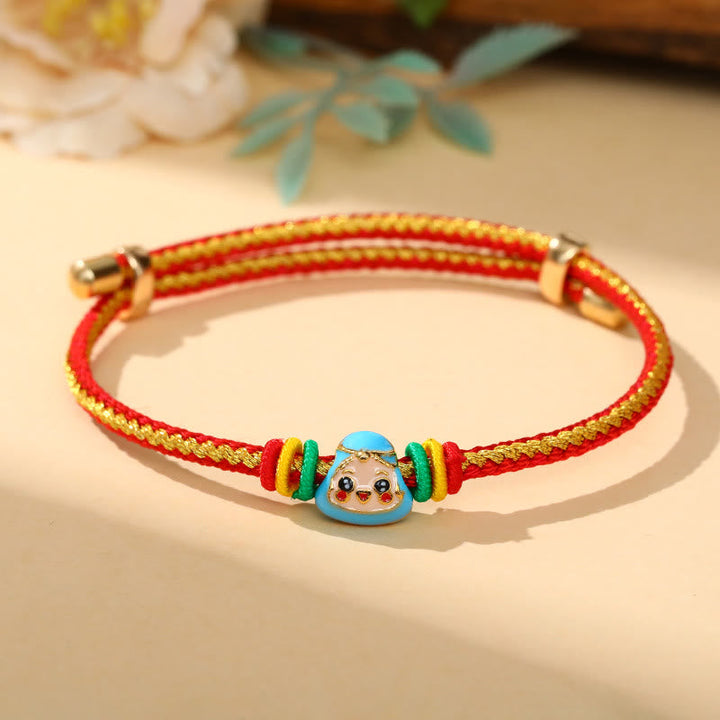 Rotes und goldenes Armband mit buntem Zongzi Glück Charm elastisch.