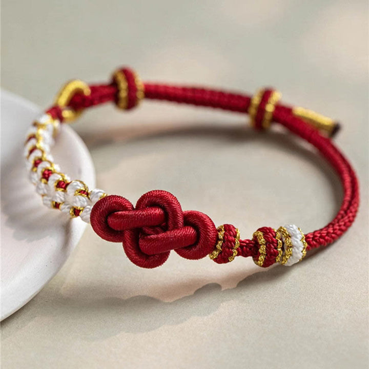 Armband Pfirsichblüte Glück Liebe rot gold elegant geknüpft