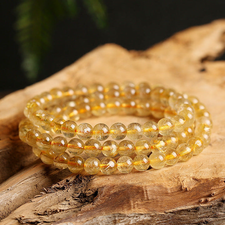 Armband Citrin – Schutz & Wohlstand goldene Perlen elastisch Naturstein glänzend