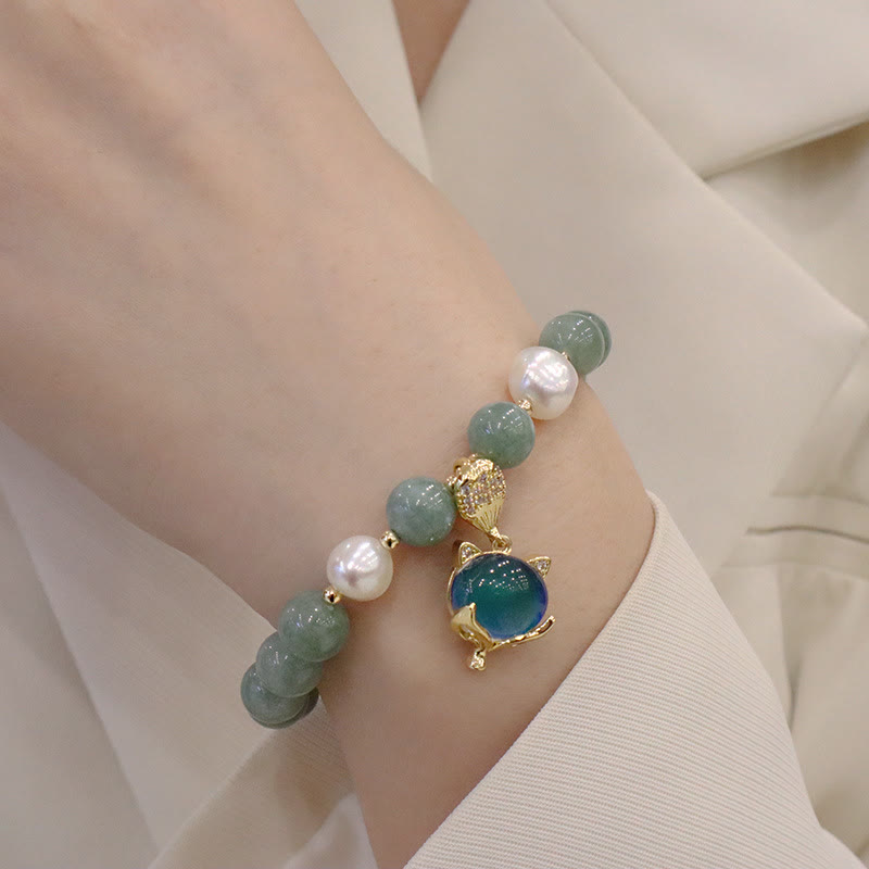 Armband Perle Jade Fuchs Glück grüner Stein elegant getragen Handgelenk