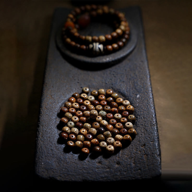 Bodhi-Samen Armband auf schwarzem Stein Wohlstand Achat braun natürlich