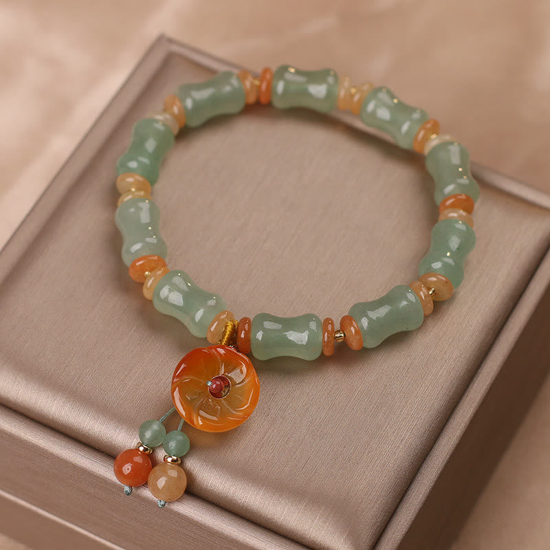 Armband Jade Bambus – Glück mit grünen Steinen und orangefarbenem Anhänger