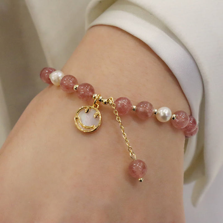Armband Erdbeerquarz Perle Fu-Zeichen Heilung Naturstein elegant getragen