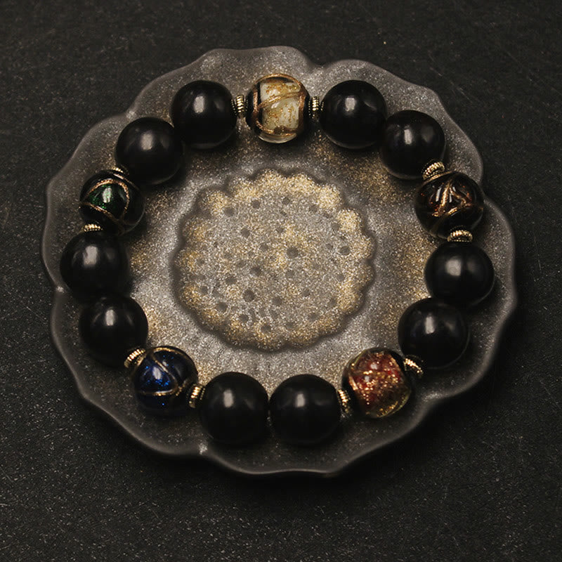 Armband – Wohlstand Harmonie schwarze Obsidian Perlen goldene Spacer elegant