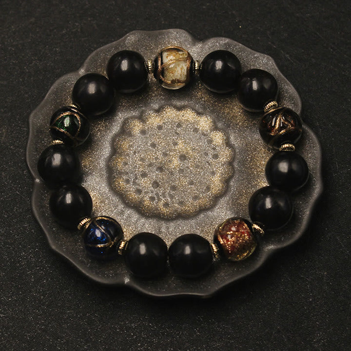 Armband – Wohlstand Harmonie schwarze Obsidian Perlen goldene Spacer elegant