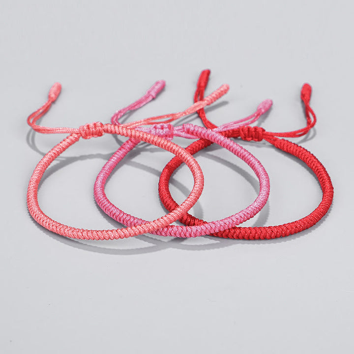 Tibetische geflochtene Knoten Armbänder in Rosa und Rot Farben