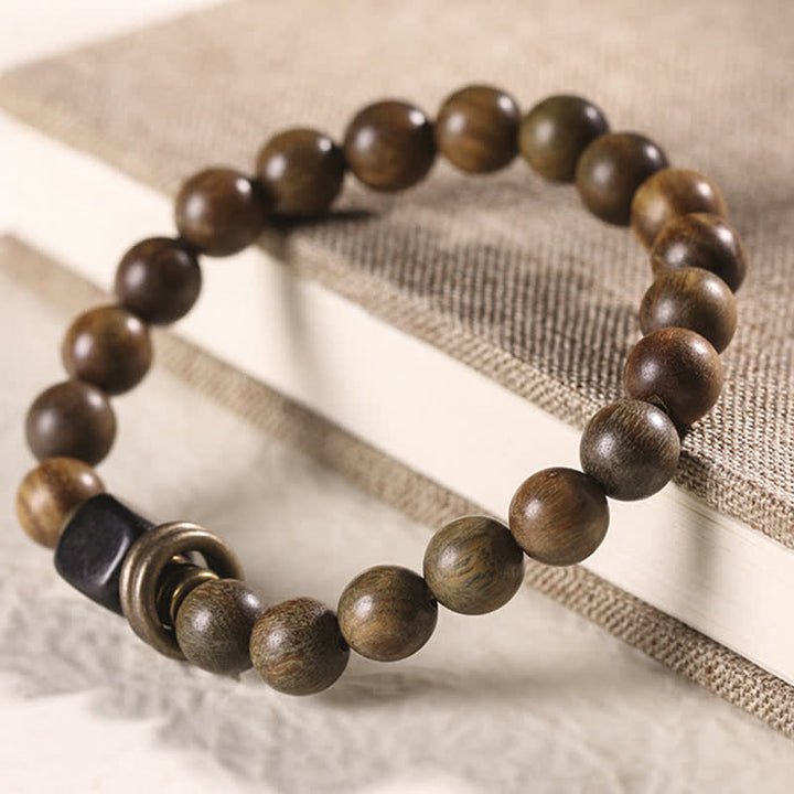 Sandelholz Armband mit braunen Perlen und schwarzem Akzent elastisch
