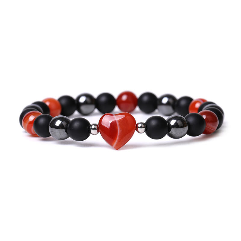Armband Schwarzer Onyx Tigerauge mit rotem Herz Anhänger elastisch