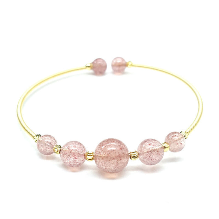 Armband Erdbeerquarz rosé Perlen goldfarbene Metallperlen elastisch adjustierbar