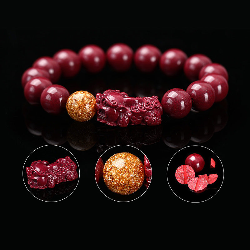 Armband Zinnober Pixiu – Ruhe mit roten Perlen und goldenem Pixiu Anhänger.