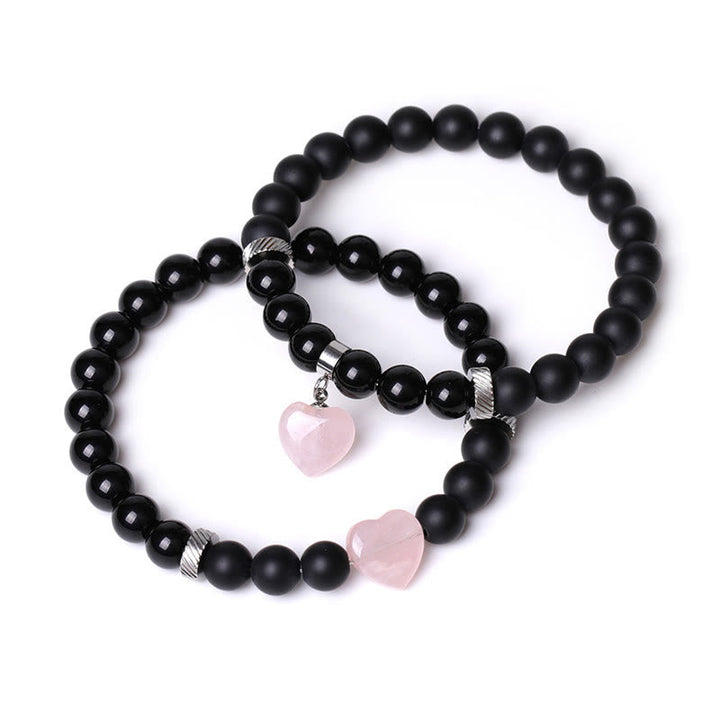 Armband Schwarzer Onyx Kristall Paar mit rosa Herz Anhängern elegant.